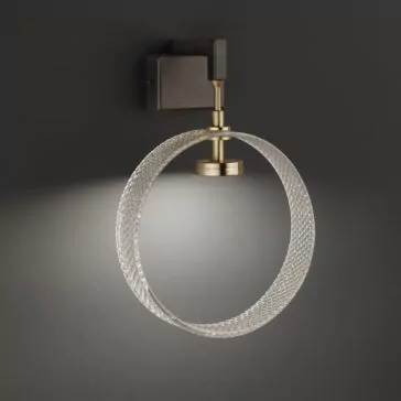 Contemporary Glass Wall Light Mounted on a dark background, the Contemporary Glass Wall Light showcases a sleek, circular design. It features a brass-colored fixture paired with a textured glass ring that emits soft, diffused light, casting an elegant glow around the surrounding area.