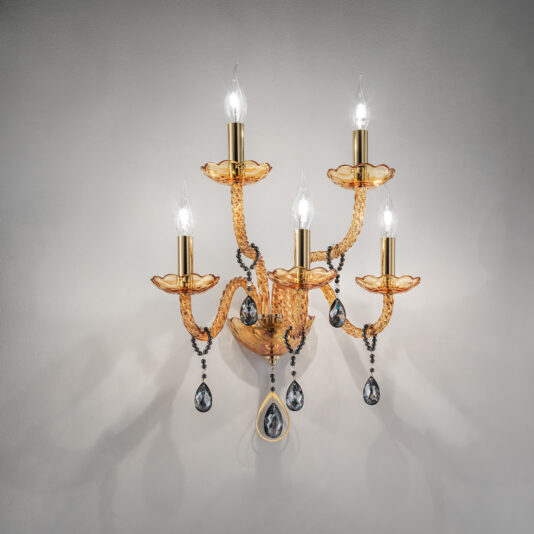 Amber Glass 5 Arm Wall Light The Amber Glass 5 Arm Wall Light is a stunning, wall-mounted gold chandelier. It features five candle-shaped light bulbs and ornate crystal accents hanging from each arm. The chandelier boasts a classic and elegant design with twisted amber glass arms and intricate decorative detailing, providing a warm and ambient light.