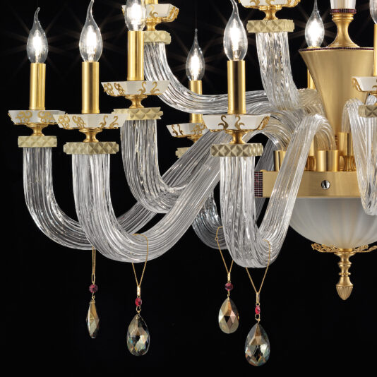 Product Description: The Large Elegant Chandelier with Pendant Drops features multiple curved glass arms and gold accents. Each arm holds a candle-like light bulb, while pendant drops and hanging crystal beads adorn the chandelier. The black background enhances the chandelier's intricate and sophisticated design.