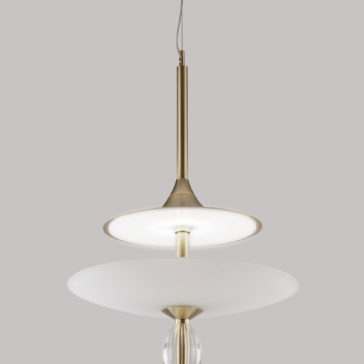 Large Modern Venetian Glass Pendant Light The Large Modern Venetian Glass Pendant Light features a sleek brass finish with two overlapping white circular shades. The top shade is smaller and opaque, while the larger bottom shade is semi-translucent Venetian glass. A single wire extends from the top for ceiling attachment.