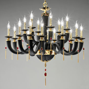Classic Black Chandelier With Swarovski® Crystals The Classic Black Chandelier With Swarovski® Crystals features 24 candle-shaped lights, curving arms, gold accents, intricate detailing, and red gemstone decorations for an elegant and opulent appearance.