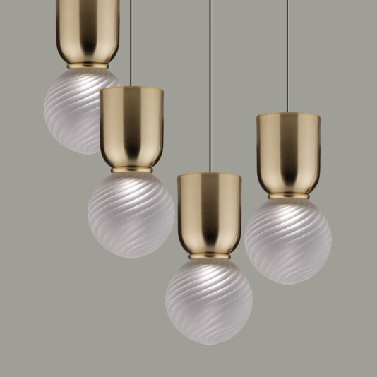 The Cluster of Modern Glass Pendant Lights, featuring four gold-colored cylindrical tops and swirled frosted glass globes, is evenly spaced and suspended from black cords against a plain grey background.