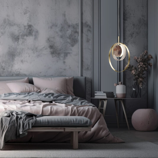 A modern bedroom showcases a double bed adorning soft pink and gray bedding, placed next to a small round table decorated with books, a plant, and a vase. The space is illuminated by the Contemporary Round Pendant Light With Marble Effect, while the room's walls feature a subtle, artistic textured pattern.