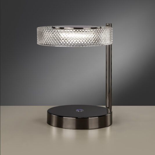 Introducing the Contemporary Round Table Lamp With Marble Effect: a modern lamp featuring a round, diamond-patterned glass shade and a sleek black metal base. It is designed with a vertical metal rod connecting the shade to the base, which includes a touch-activated control button. The background boasts an elegant neutral grey marble effect.