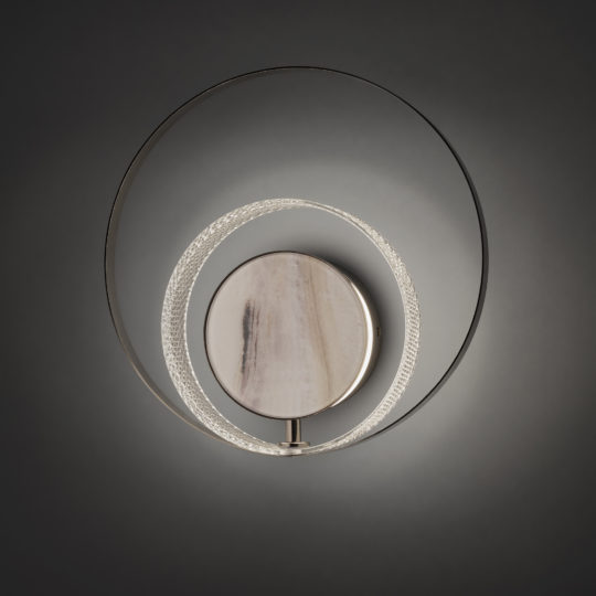 The Contemporary Round Wall Light With Marble Effect features a central opaque disc with a brushed metal finish, surrounded by two concentric circles: one is metallic and solid, while the other displays a textured marble effect. This wall sconce emits a soft, ambient light.