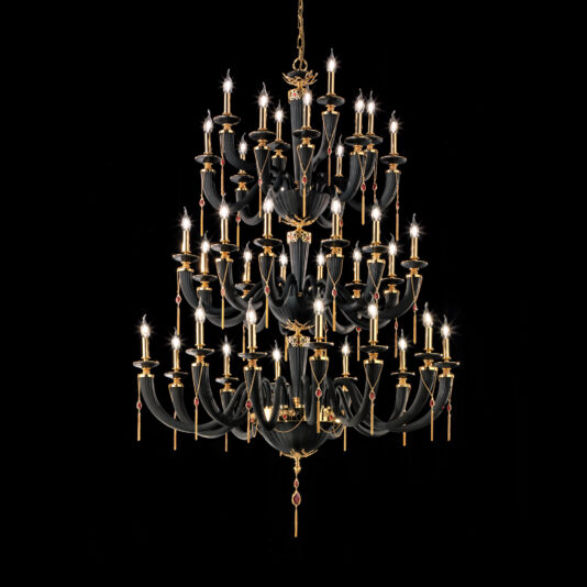 Against a black background hangs the Large Classic Black Chandelier With Swarovski® Crystals, an ornate, multi-tiered masterpiece. This sumptuous fixture boasts numerous candle-like lights arranged in circular patterns and is adorned with gleaming Swarovski® crystals and golden accents, exuding a luxurious and classical aesthetic.