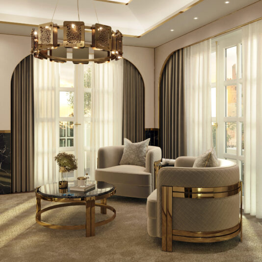 Modern Curved Armchair With Brass Frame Luxurious living room with two plush, cream-colored armchairs featuring gold accents, a Modern Curved Armchair With Brass Frame, a round glass coffee table with gold trim, and floor-to-ceiling windows draped in white and gray curtains. A large, ornate chandelier hangs from the ceiling, casting a warm glow.