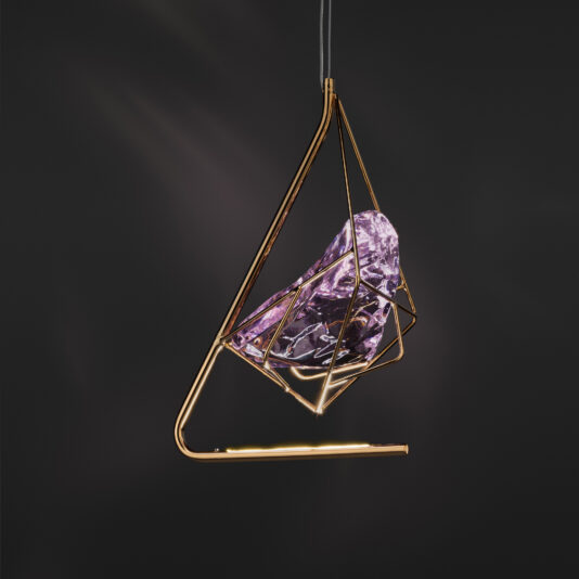 Rose Crystal Rock Pendant Light The Rose Crystal Rock Pendant Light features a modern design with a geometric gold frame encasing a large, faceted rose crystal rock. Suspended against a dark background, this pendant light gracefully highlights the intricate details and reflective qualities of the crystal.