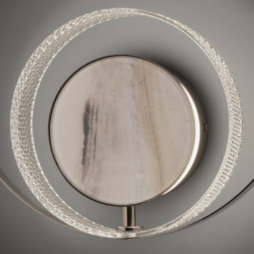 Contemporary Round Wall Light With Marble Effect The Contemporary Round Wall Light With Marble Effect showcases a modern design, featuring a circular, lightly patterned central disc surrounded by an illuminated ring with a textured surface. This light emits a soft and elegant glow, accentuating the intricate details of the ring and the subtle design of the central disc.