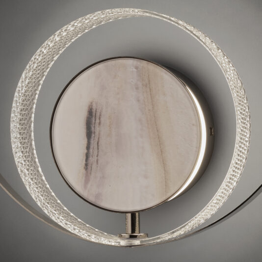 Contemporary Round Wall Light With Marble Effect The Contemporary Round Wall Light With Marble Effect showcases a modern design, featuring a circular, lightly patterned central disc surrounded by an illuminated ring with a textured surface. This light emits a soft and elegant glow, accentuating the intricate details of the ring and the subtle design of the central disc.