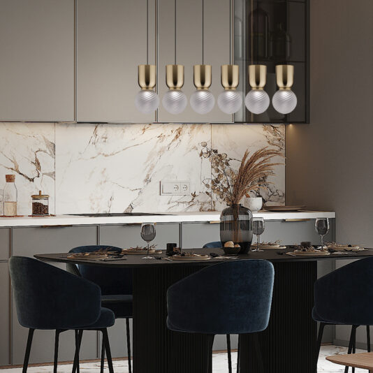 Row of Six Modern Glass Pendant Lights A modern dining area with a black table and six dark blue chairs. Above the table, the