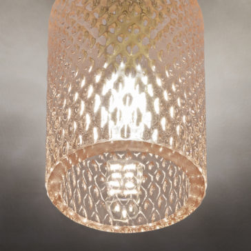 A close-up view of the Spotlight With Balloton Effect Glass Shade showcases its beautifully textured surface. The diamond-patterned glass diffuses the light, creating a warm and intricate illumination, while the visible bulb adds a soft, ambient glow to the spotlight.