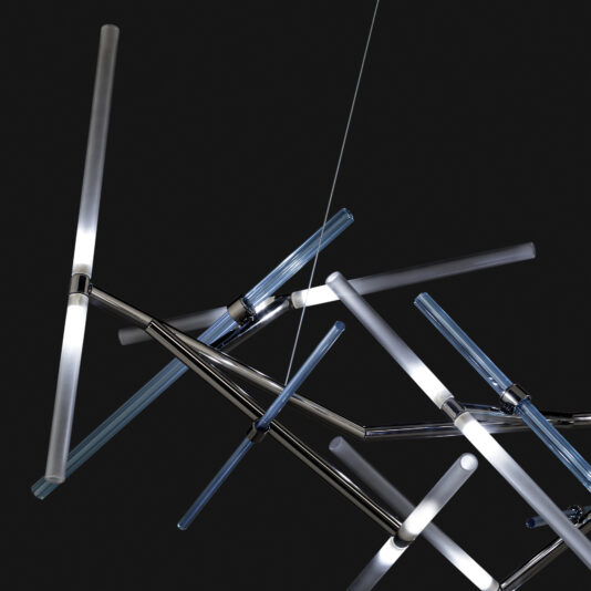 The Contemporary Murano Glass Tube Chandelier, characterized by its modern and abstract design, features intersecting linear light rods set against a dark background. Crafted from glass and metal, the rods emit a soft, white glow that enhances its geometric and contemporary aesthetic. A single rod is suspended by a thin wire.
