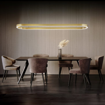 A modern dining room features a dark wooden table surrounded by six cushioned chairs in varying shades of beige and brown. Above the table hangs the Contemporary Oval Downlight Chandelier. A glass vase with pampas grass sits as a centerpiece on the table.