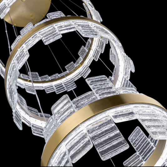 This close-up image highlights the Large Modern Tiered Venetian Glass Chandelier, featuring circular metal fixtures decorated with rectangular, textured Venetian glass pieces. The chandelier's vertically suspended rings create a sophisticated and artistic design, set against a black background.