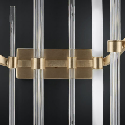 Large Vertical Murano Glass Tube Wall Light Close-up of the Large Vertical Murano Glass Tube Wall Light, featuring multiple large vertical Murano glass tubes. The rods are mounted onto a rectangular brass base against a dark background, with lighting that accentuates the glass and metal textures.