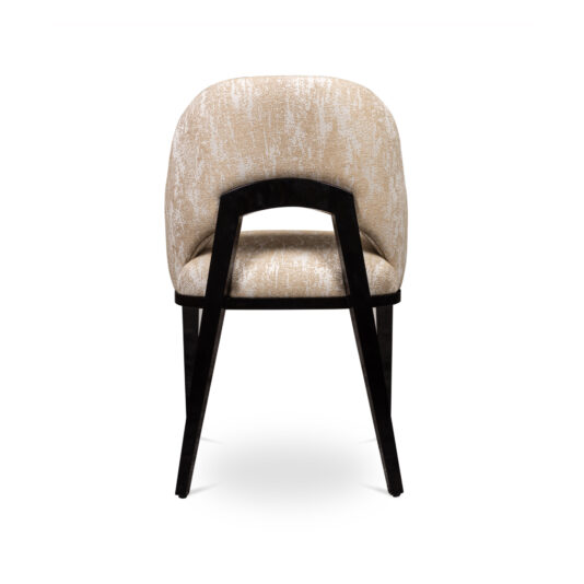 Modern Art Deco Style Tub Dining Chair The Modern Art Deco Style Tub Dining Chair, featuring a cream-colored, textured fabric and a dark wooden frame, is shown from the back. It boasts a curved backrest with an open space at the lower portion and is supported by four sleek, angled legs.