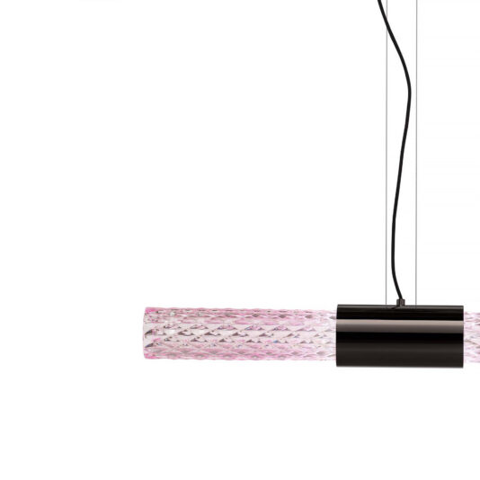 Modern Faceted Crystal Horizontal Pendant Light A close-up image of the Modern Faceted Crystal Horizontal Pendant Light, featuring a textured cylindrical glass shade in pink. The fixture is suspended by black cords against a white background.