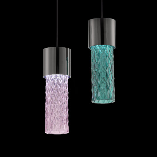 A pair of Modern Faceted Crystal Pendant Lights featuring cylindrical, textured glass shades. The one on the left showcases a pink shade, while the one on the right has a teal shade. Both lights are adorned with sleek metallic tops and black cords, all set against a black background.