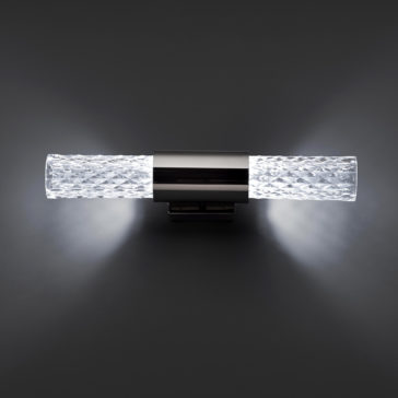 Modern Faceted Crystal Wall Light The Modern Faceted Crystal Wall Light features a metallic central base and textured glass tubes that emit bright white light from both ends. The contrast against the dark background enhances its sleek and contemporary appearance.