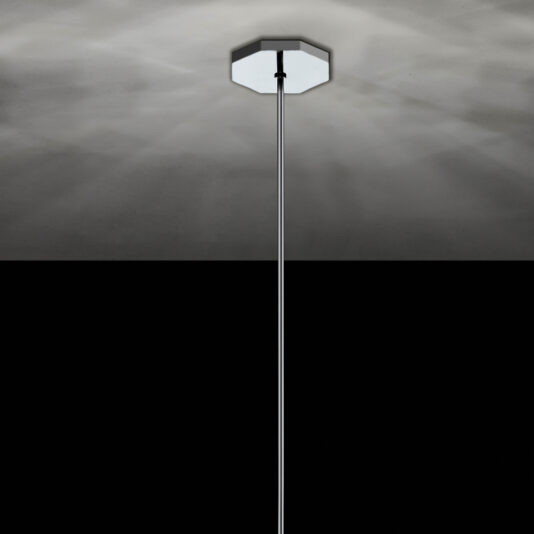 Modern Geometric Pendant Light A minimalistic image showcasing the Modern Geometric Pendant Light, a sleek and contemporary fixture extending from a central ceiling mount. It emits a subtle, diffused glow that creates a soft ambiance on the ceiling, contrasted by the dark lower half of the image.
