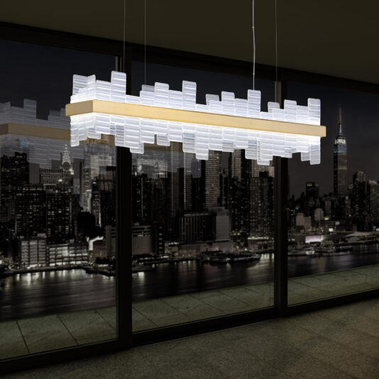 Modern Rectangular Venetian Glass Chandelier A Modern Rectangular Venetian Glass Chandelier, adorned with an intricate pattern of glass pieces, hangs elegantly from the ceiling in a dark room. The background features a night view of a city skyline with lit-up skyscrapers seen through large windows.