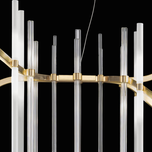 A close-up of the Vertical Murano Glass Tube Modern Chandelier highlights its clear cylindrical Murano glass tubes arranged vertically. These elements are connected by a golden metal frame, creating an elegant and contemporary design. Set against a black background, the sleek and sophisticated appearance of the chandelier is accentuated.
