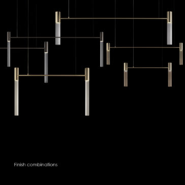 Large Contemporary Modular Glass Tube Chandelier The Large Contemporary Modular Glass Tube Chandelier is displayed against a black background, showcasing its minimalist design with vertical and horizontal cylindrical rods in various metallic finishes such as black, gold, and silver. Glass tubes add a modular touch to the chandelier. The text