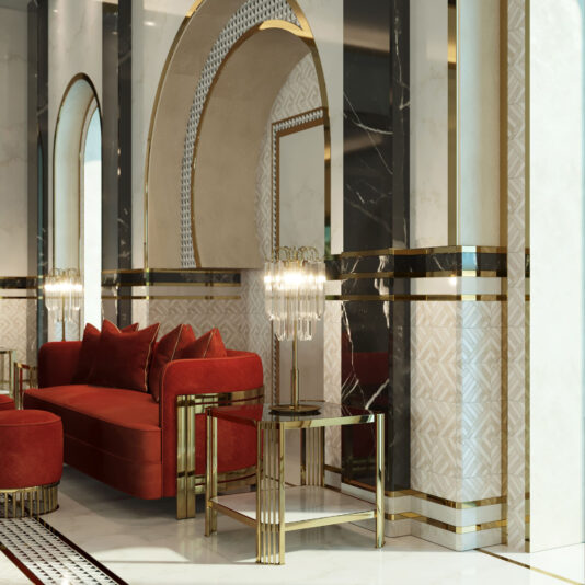 Immerse yourself in an elegant interior adorned with luxurious gold and red accents. The centerpiece, a plush red sofa with matching pillows, is set against a backdrop of striking black and white marble walls. Our Art Deco Inspired Square Side Tables grace the room, each topped with modern glass lamps. Ornate arches enhance the space further, seamlessly blending traditional opulence with contemporary sophistication.