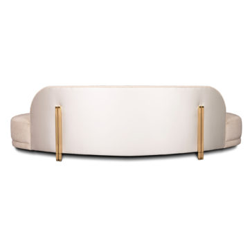 A rear view of an elegant, modern white sofa with a curved backrest, supported by two sleek gold metal legs. The design is minimalist, with a smooth surface and no visible cushions on this side. The sofa is set against a plain white background.