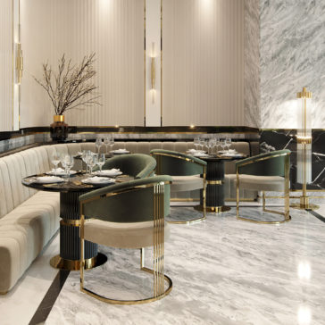 Contemporary Lacquered Round Bistro Dining Set A sophisticated restaurant interior featuring elegant seating with plush cushions arranged around the Contemporary Lacquered Round Bistro Dining Set. The decor includes marble floors and walls, gold accents, modern lighting, and a minimalistic plant centerpiece, creating a luxurious and serene atmosphere.