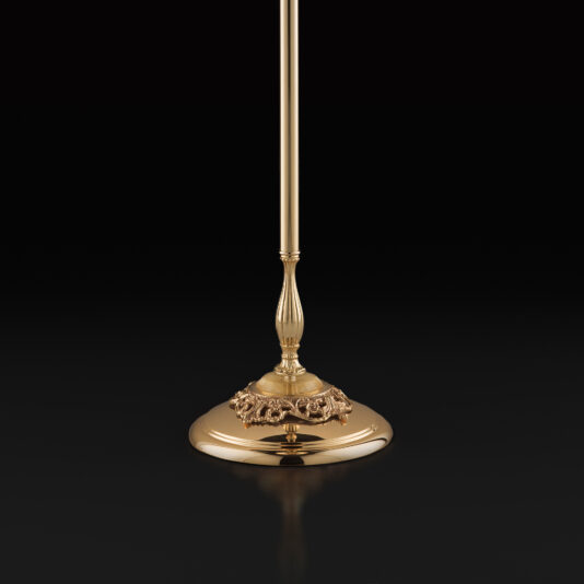 Hand Blown Glass Floor Lamp With Flowers A close-up view of the base of the Hand Blown Glass Floor Lamp With Flowers reveals its ornate, golden design. The polished, rounded base boasts intricate decorative details and a smooth, reflective finish, all set against a black background.