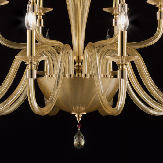 Hand Blown Gold Sheen Glass Chandelier A close-up view of the elegant Hand Blown Gold Sheen Glass Chandelier showcases its multiple curved arms and candle-shaped light bulbs, along with a decorative hanging crystal at the bottom, all set against a dark background.
