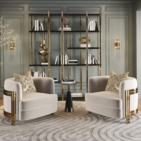 Large Modern Open Bookcase A sophisticated living room features two plush, light-colored armchairs with gold accents, positioned around a sleek black side table. The backdrop boasts the Large Modern Open Bookcase adorned with books and decorative items, set against a paneled wall.
