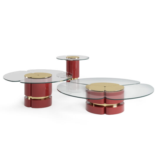 The Modern Lacquered Coffee Table Set boasts a sleek design, featuring circular glass tops supported by red cylindrical bases accented with gold. The set includes three tables of varying heights, each offering smooth, minimalist lines and a sophisticated aesthetic.
