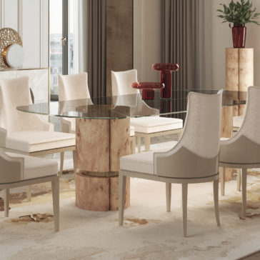 Modern Veneered Rectangular Glass Dining Table A modern dining room showcases the Modern Veneered Rectangular Glass Dining Table, which boasts a beige, abstract-patterned base and is paired with eight beige upholstered chairs. Contemporary red vase decor is displayed on a small pedestal. Large windows allow natural light to flood in, while beige curtains and a patterned rug add to the elegant ambiance.