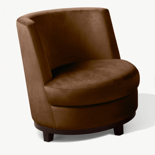The Quilted Occasional Chair With Swivel Base is a round, brown upholstered curved occasional chair featuring a curved backrest and wooden legs. The chair boasts a plush, cushioned seat and a sleek, modern design. The white background highlights the chair's details and color.