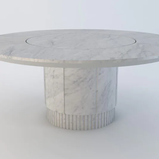 Exclusive Round Marble Dining Table The Exclusive Round Marble Dining Table boasts a thick, cylindrical pedestal base and a smooth, white marble surface with subtle veining. Its elegant and modern design is highlighted against a plain white background.