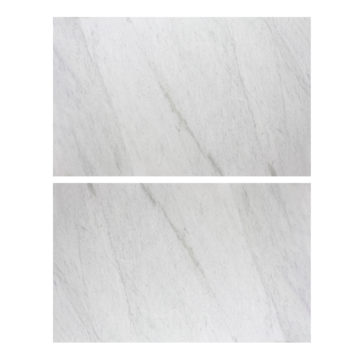Exclusive Round Marble Dining Table Two rectangular white marble tiles with delicate grey veining are arranged horizontally, one above the other. They exhibit a smooth, polished surface and a natural stone pattern that perfectly complements the Exclusive Round Marble Dining Table.