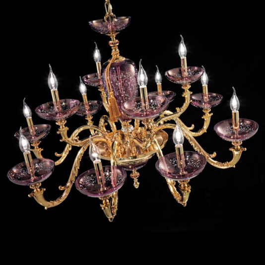 The Hand Blown Amethyst Glass Chandelier is a luxurious light fixture with gold detailing, boasting 15 ornate arms that each hold a candle-shaped light bulb. The bulbs are elegantly set on translucent hand-blown amethyst glass plates, creating a regal and sophisticated appearance against a black background.