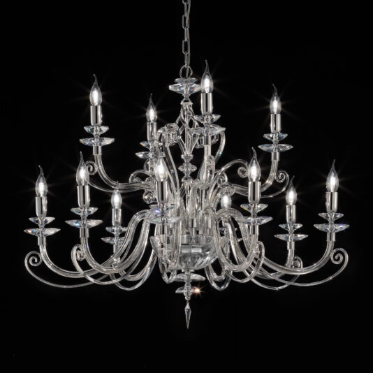 The Classic Candle Style Chandelier, an elegant fixture adorned with multiple curved arms and crystal accents, features candle-shaped light bulbs. Hanging against a black background, its sophisticated and intricate design emits a bright, warm glow.