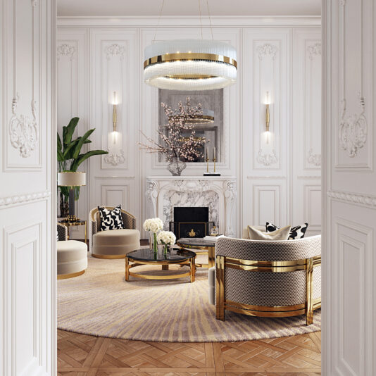 Large Modern Round Chandelier Elegant living room with intricate white wall paneling and a parquet wood floor. Features a marble fireplace, plush round seating with gold accents, and a circular rug. A Large Modern Round Chandelier hangs above a round coffee table adorned with a floral arrangement. Wall sconces provide ambient lighting.
