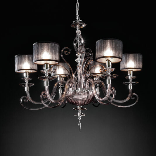 The Modern Smoked Glass Chandelier features six intricately designed arms, each supporting an illuminated bulb covered by a gray fabric lampshade. Suspended by a chain against a dark black background, it exudes elegance and detailed craftsmanship.