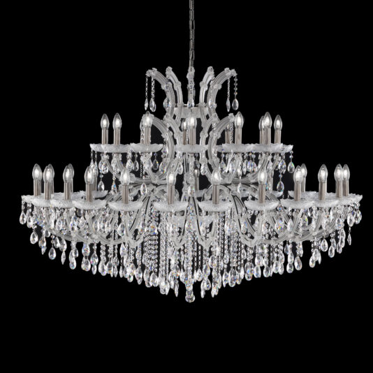 The Satin Glass Classic Style Chandelier is an ornate, multi-tiered chandelier with numerous candle-shaped light bulbs and intricate detailing that hangs from a chain. Adorned with strands of sparkling crystals that catch the light, it incorporates elements of satin glass set against a black background.
