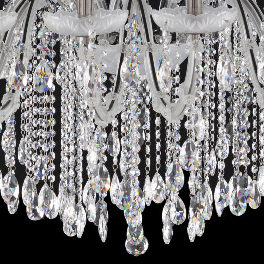 Close-up of the Satin Glass Classic Style Chandelier with ornate detailing, featuring hanging crystal droplets and beads. The crystals catch light to produce a sparkling, rainbow-hued effect. The intricate design exhibits detailed craftsmanship and elegance, while the black background accentuates the brilliance of the chandelier.