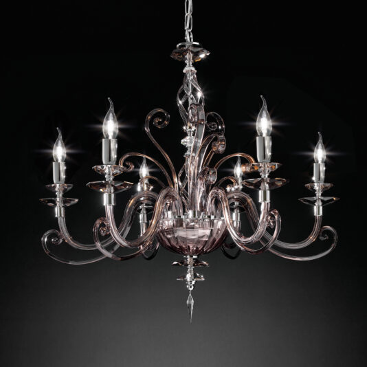The Smoked Glass 6 Arm Chandelier, showcasing an intricate, symmetrical design and suspended from a chain against a dark background, features multiple curved arms adorned with glass elements and six candle-like light bulbs that emit a soft, elegant glow.