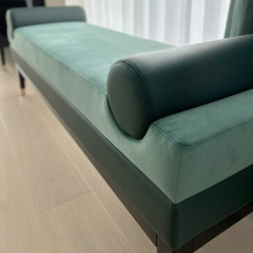 Mid-Century Style Bench Green velvet and leather contemporary designer bench with bolster cushion inset close-up