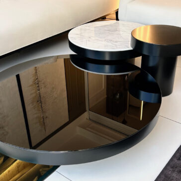 Presenting the Set Of 3 Modern Round Coffee Tables, featuring varying heights and surface finishes: glossy black, black matte, and white marble. These tables reflect the elegance of your room's interior, enhancing any space with a touch of sophistication.