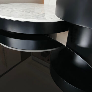 Product Data: Set Of 3 Modern Round Coffee Tables

A modern set of three round coffee tables with black cylindrical legs, featuring a sleek design with layered appearance and reflective surfaces, seamlessly blending contemporary style with minimalist elegance.