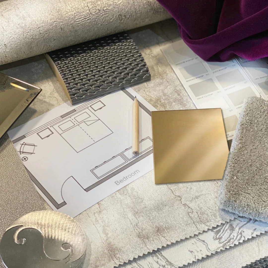 Moodboard with greys and golds and purple used in our interior design process with samples and drawings